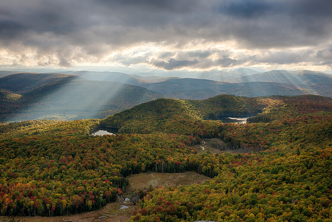 USA, New York State. Autumn sunrays in the mountains, Adirondack Mountains.