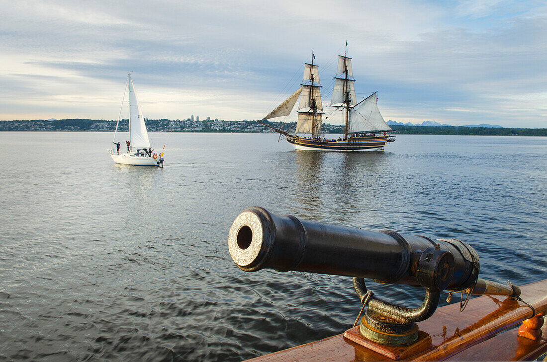 Lady Washington sailing in Semiahmoo Bay, Washington State. A historic replica of the original 18th Century brig. Three pound gun swivel mounted gun on the Hawaiian Chieftain is in the foreground.