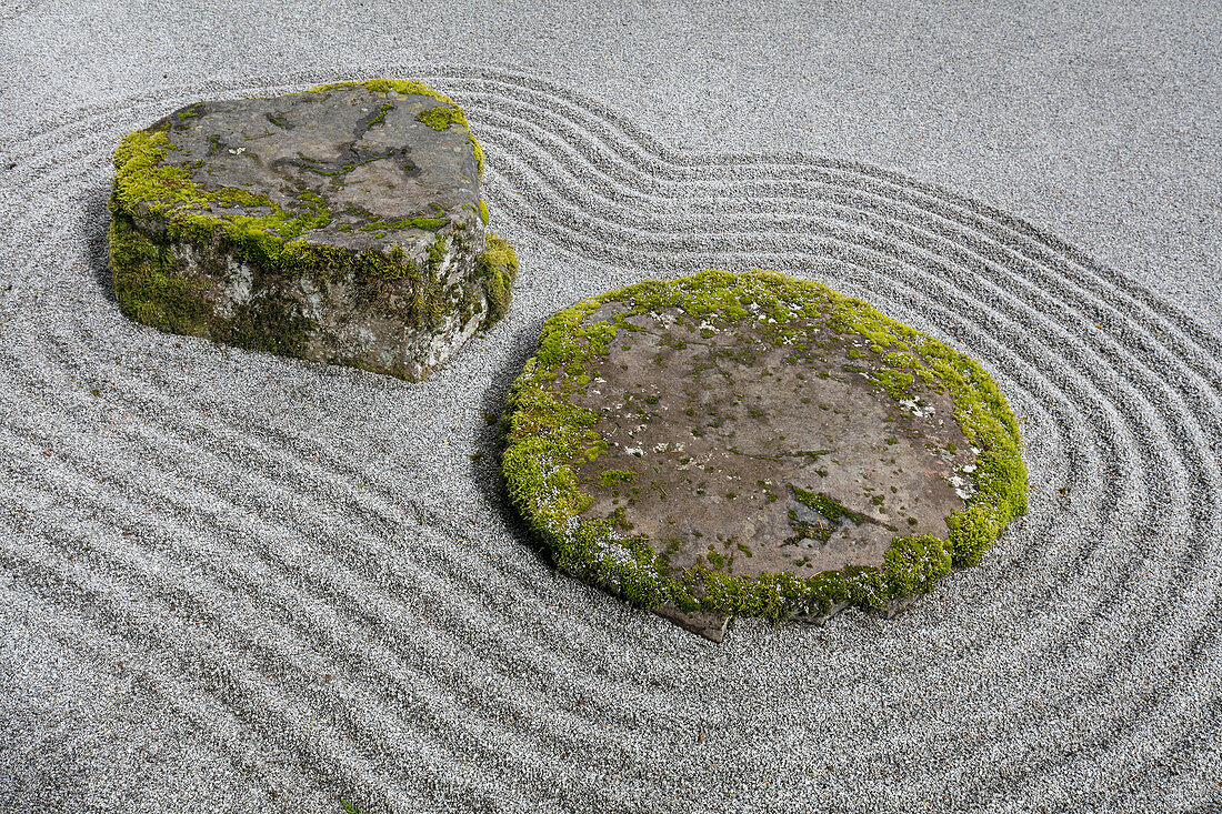 USA, Washington State, Bainbridge Island. Raked sand around rock