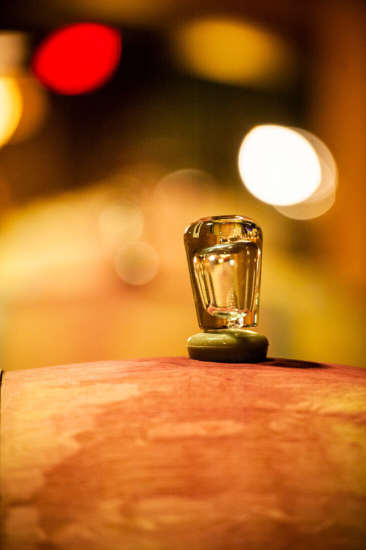 USA, Washington State, Red Mountain. Glass bung on a barrel in the Col Solare winery.