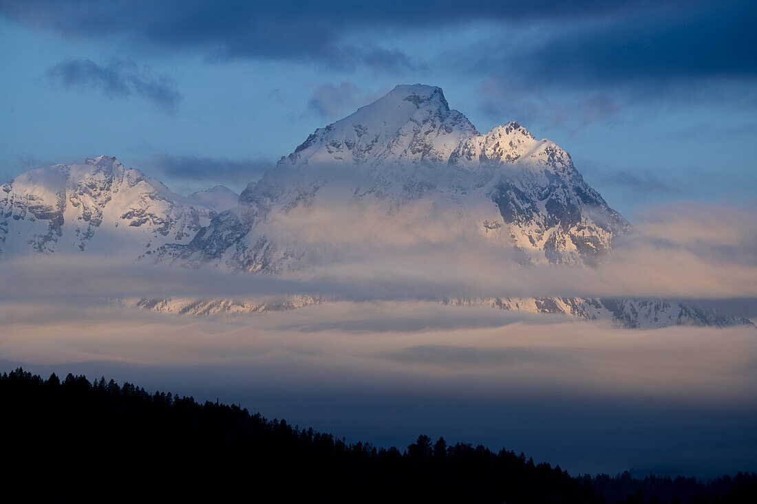 USA, Wyoming, Grand Teton National Park. Sunrise on cloudy Teton Range.