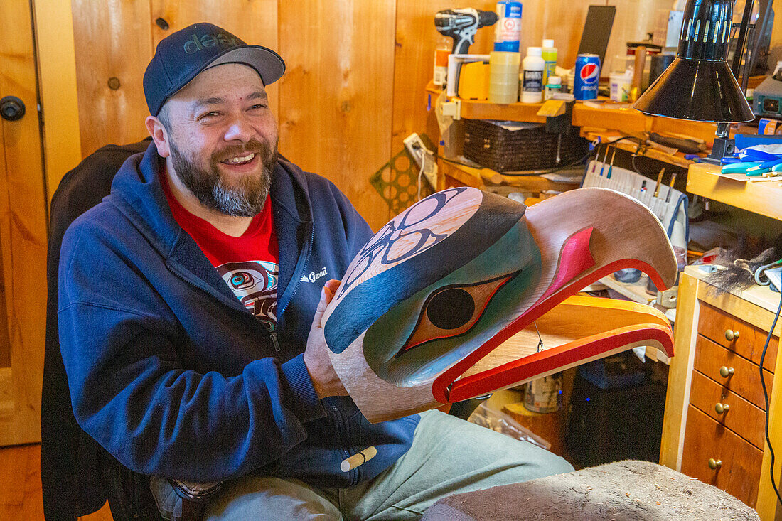 Artisan with traditional mask in Old Massett (Gaw in Xaad kil), Graham Island (Haida Gwaii), British Columbia, Canada, North America