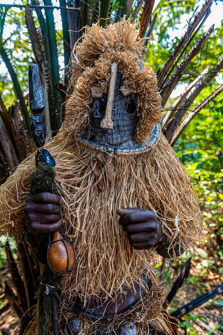 Traditional masked man, Yaka tribe, Mbandane, Democratic Republic of the Congo, Africa