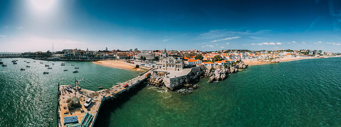 Aerial drone panoramic view of Cascais historic centre with the iconic Bay and Ribeira Beach, 30km west of Lisbon on the Portuguese Riviera, Cascais, Portugal, Europe