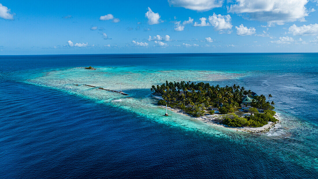 Aerial of the little island at the Avatoru Pass, Rangiroa atoll, Tuamotus, French Polynesia, South Pacific, Pacific