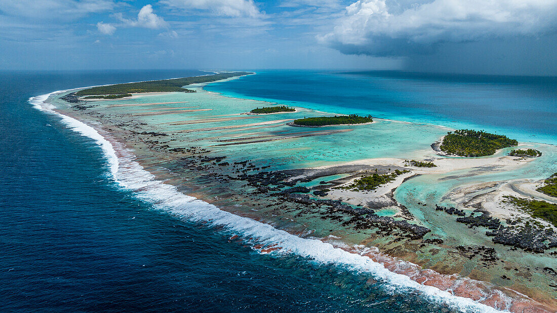 Aerial of the elevated reefs of Ile aux Recifs, Rangiroa atoll, Tuamotus, French Polynesia, South Pacific, Pacific