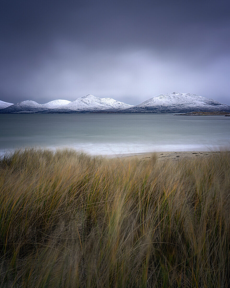 Winter at Luskentyre beach with snow capped mountains, Isle of Harris, Outer Hebrides, Scotland, United Kingdom, Europe