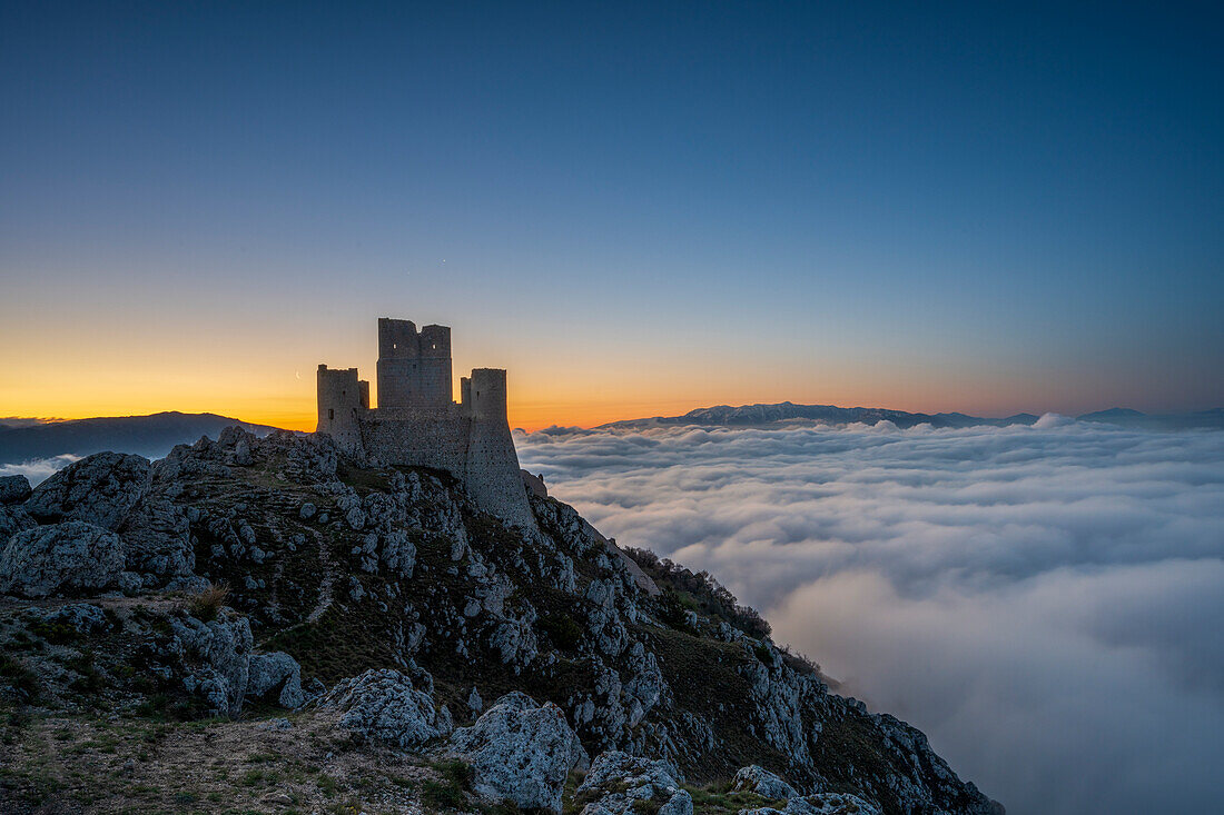 Rocca Calascio at sunrise with cloud inversion, Calascio, L'Aquila, Abruzzo, Italy, Europe