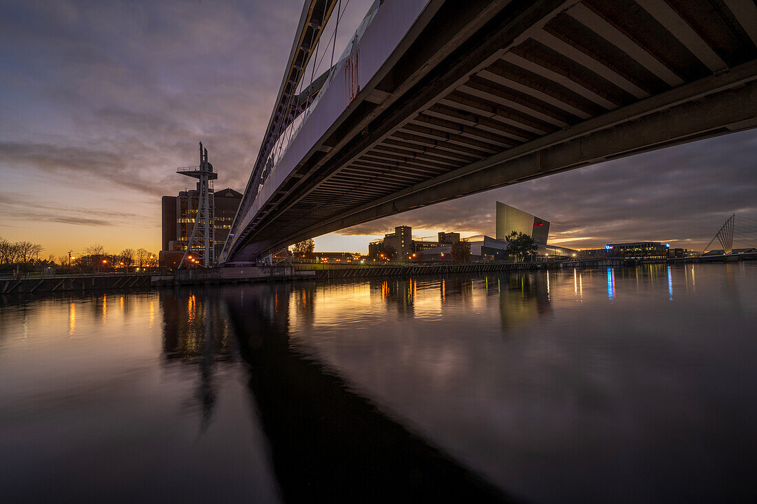 Footbridge and Imperial War Museum North at night, Salford Quays, Manchester, England, United Kingdom, Europe