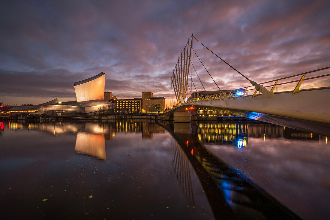 Imperial War Museum North and swingbridge reflected at night, Salford Quays, Manchester, England, United Kingdom, Europe