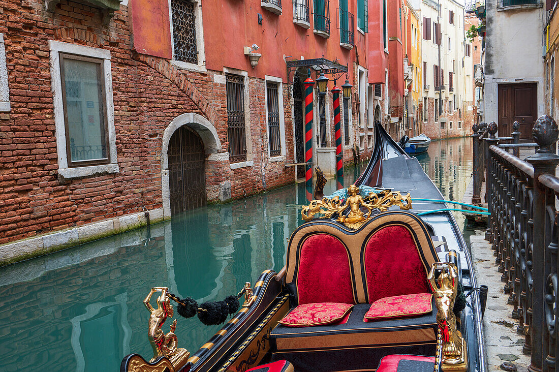 Venetian gondola moored on a canal, Venice, UNESCO World Heritage Site, Veneto, Italy, Europe