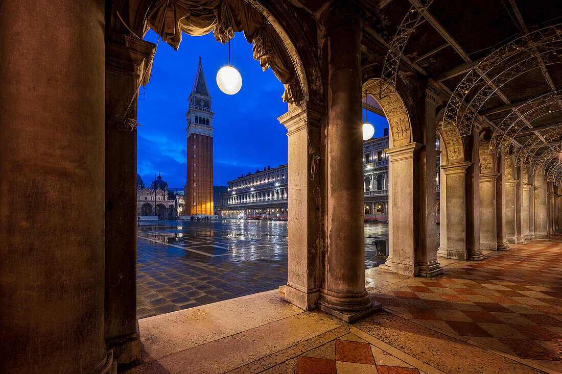 St. Mark's Square at night with the Campanile bell tower viewed through arches, San Marco, Venice, UNESCO World Heritage Site, Veneto, Italy, Europe