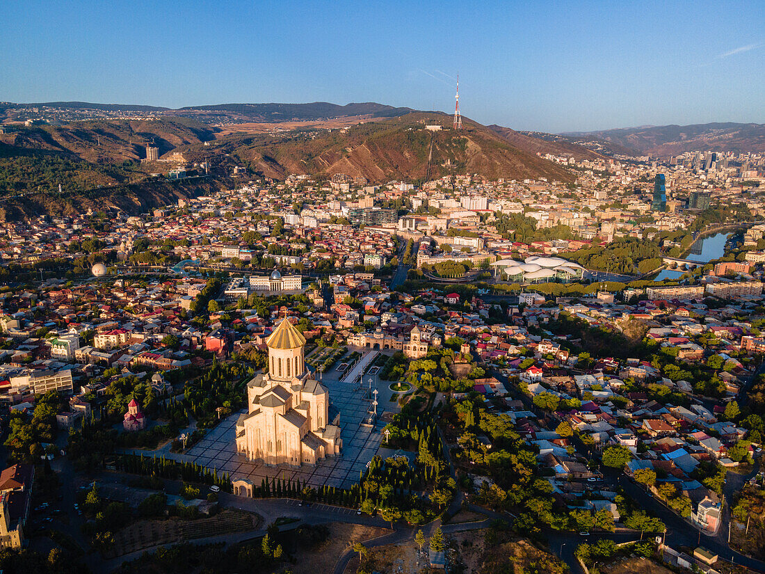 Holy Trinity Church overlooking main sights of Peace Bridge, Mother of Georgia, and the Old Town, Tbilisi, Georgia (Sakartvelo), Central Asia, Asia