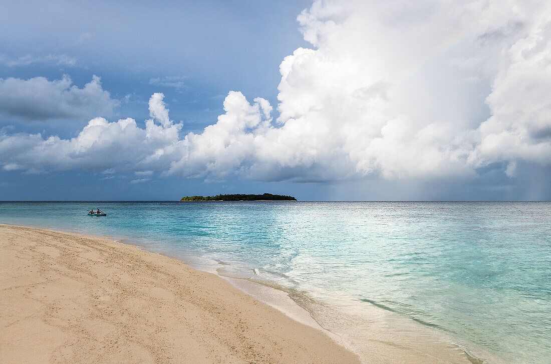 A couple canoeing in Baa Atoll, Maldives, Indian Ocean, Asia