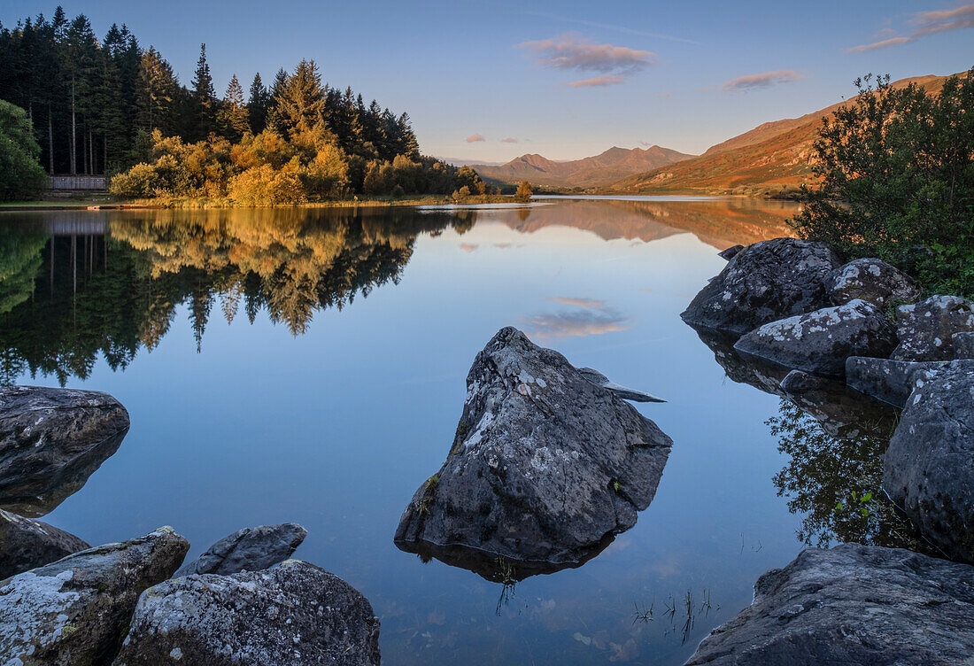 First light on the Snowdon Range over Lynnau Mymbyr, near Capel Curig, Snowdonia National Park, North Wales, United Kingdom, Europe