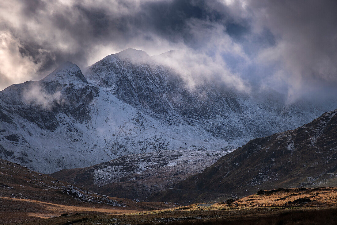 Clouds swirl around Y Lliwedd viewed from Dyffryn Mymbyr in winter, Eryri, Snowdonia National Park, North Wales, United Kingdom, Europe