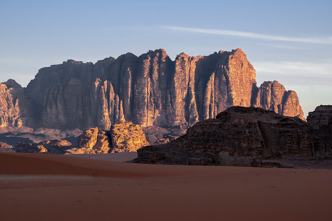 Red rocks and mountains at sunrise in the Wadi Rum desert, UNESCO World Heritage Site, Jordan, Middle East