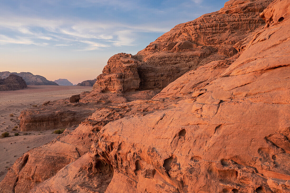 Red rocks and mountains at sunset in the Wadi Rum desert, UNESCO World Heritage Site, Jordan, Middle East