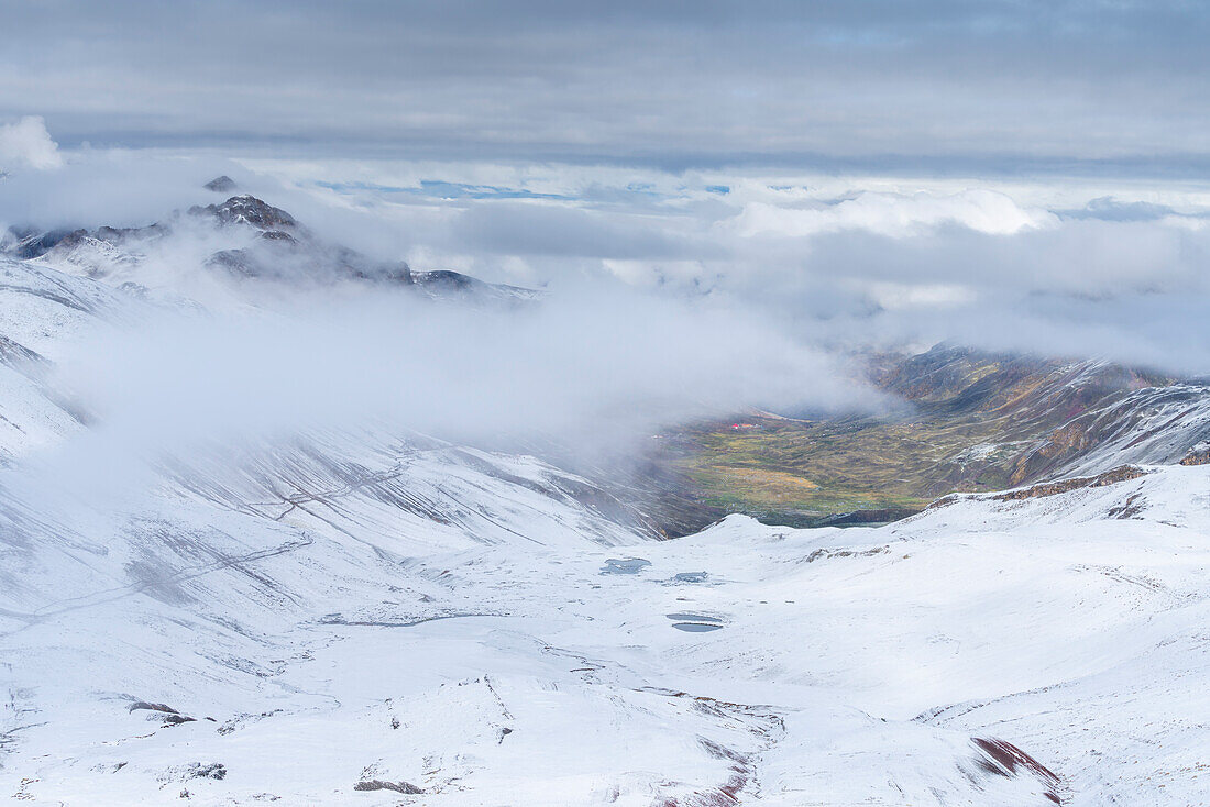 Snow-covered landscape near Rainbow Mountain (Vinicunca), Red Valley, Cusco, Peru, South America