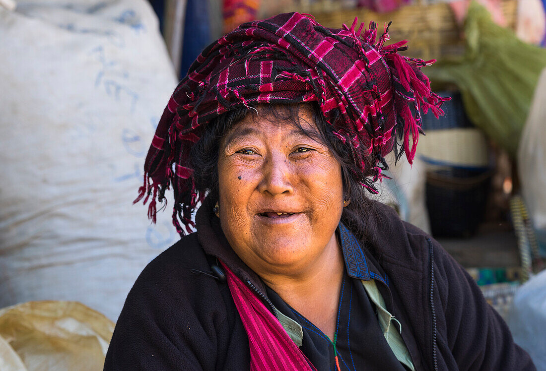 Portrait of woman with traditional headwear, Inn Thein market, Lake Inle, Shan State, Myanmar (Burma), Asia