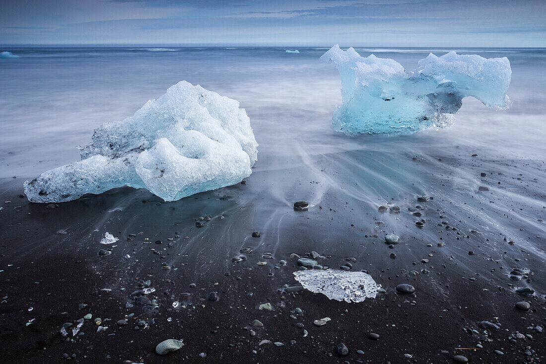 Chunks of ice washed by sea, Diamond beach near Jokulsarlon glacier lagoon, Iceland, Polar Regions