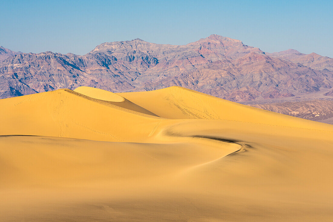 Mesquite Flat Sand Dunes and rocky mountains in desert, Death Valley National Park, California, United States of America, North America