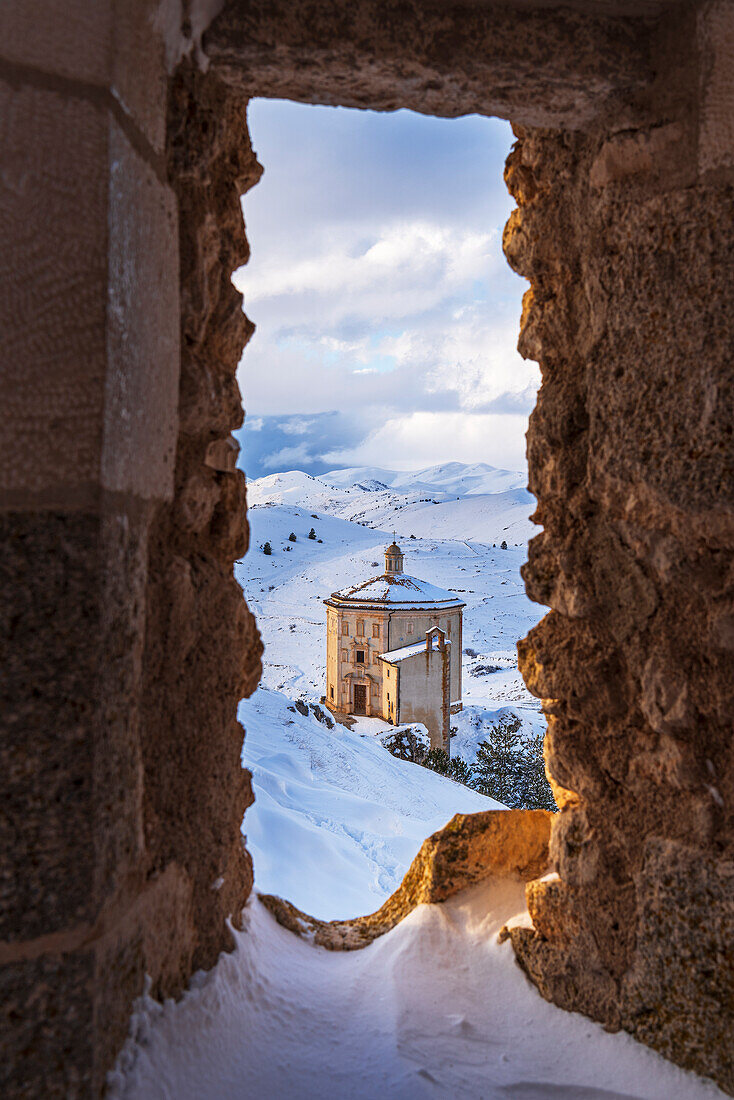 Winter view of the Renaissance church of Santa Maria della Pieta with snow seen from the castle of Rocca Calascio, Gran Sasso e Monti della Laga National Park, Campo Imperatore, L'Aquila province, Abruzzo, Italy, Europe
