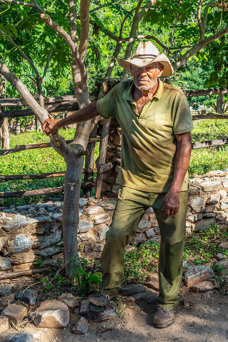 Farmworker taking a break at farm near Trinidad, Cuba, West Indies, Caribbean, Central America