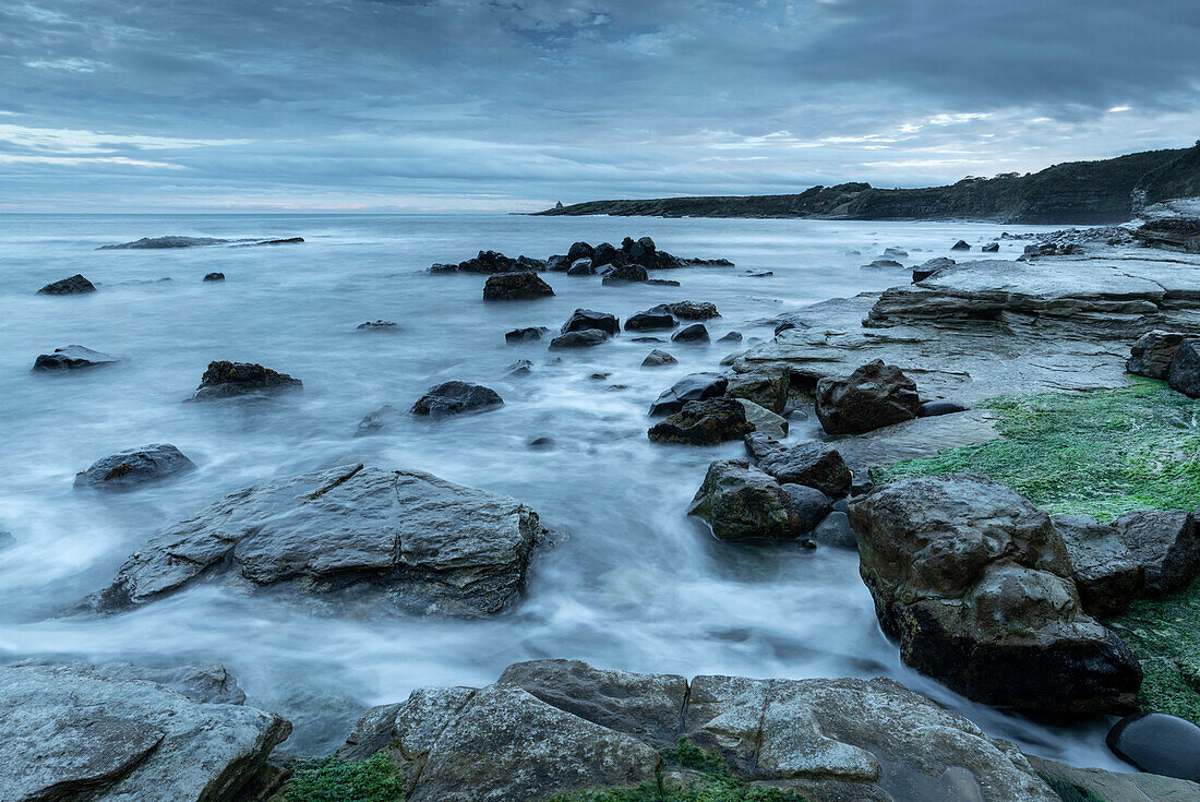 Twilight over the rocky shores of Swine Den near Howick, Northumberland, England, United Kingdom, Europe