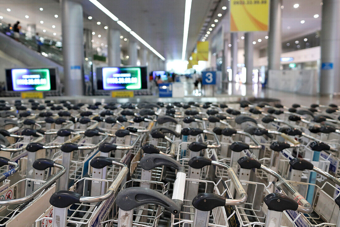 Baggage trolleys in arrivals area, International Airport, Ho Chi Minh City, Vietnam, Indochina, Southeast Asia, Asia