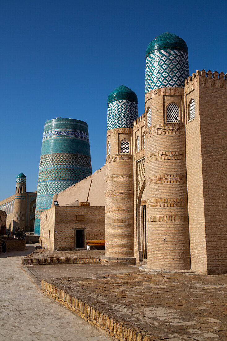 Entrance Gate, Kalta Minaret in the background, Kunya Ark Citadel, Ichon Qala (Itchan Kala), UNESCO World Heritage Site, Khiva, Uzbekistan, Central Asia, Asia