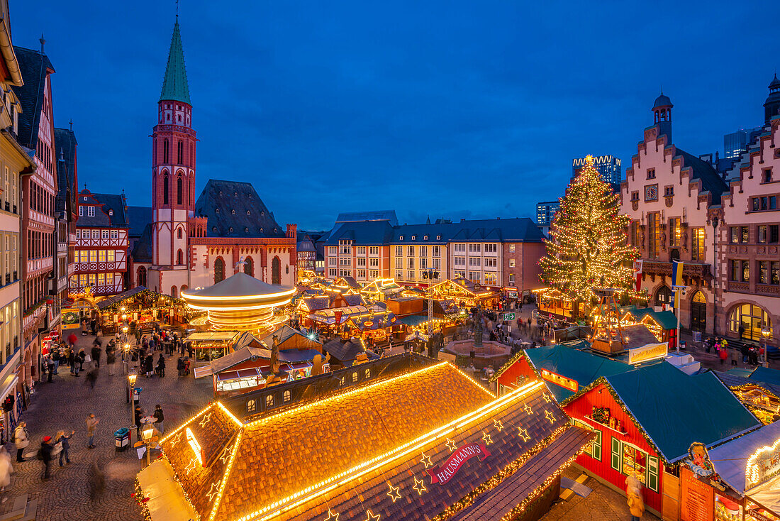 View of carousel and Christmas Market stalls at dusk, Roemerberg Square, Frankfurt am Main, Hesse, Germany, Europe