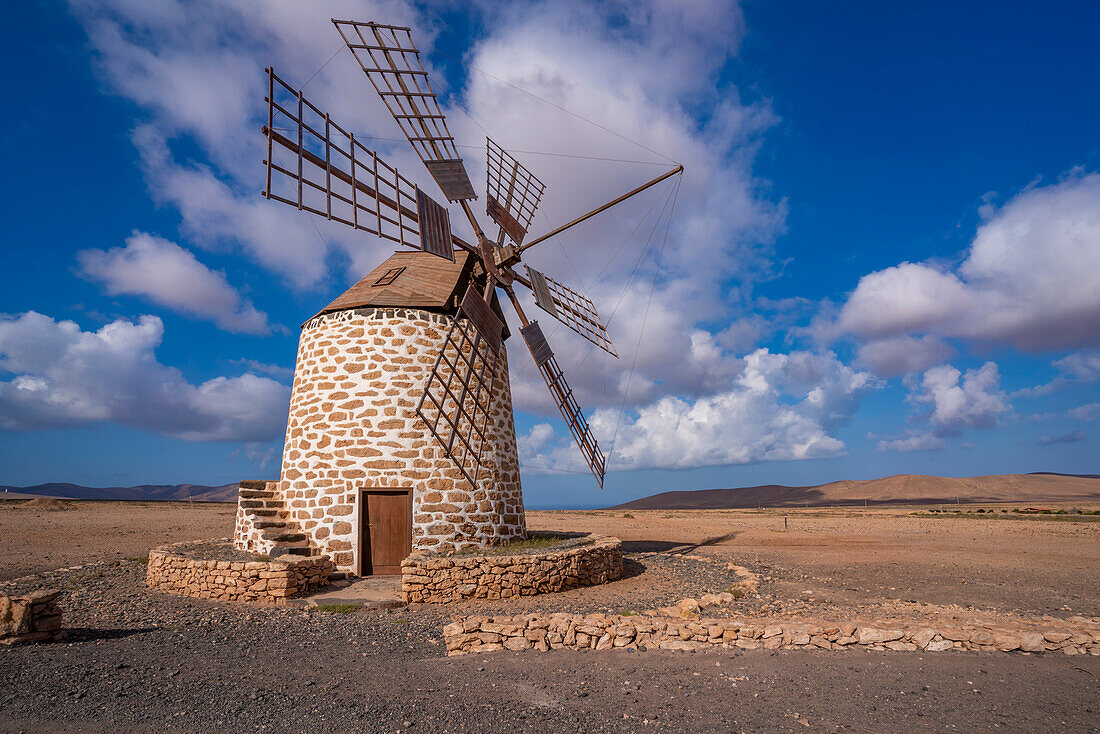 View of traditional windmill and landscape on a sunny day, La Oliva, Fuerteventura, Canary Islands, Spain, Atlantic, Europe