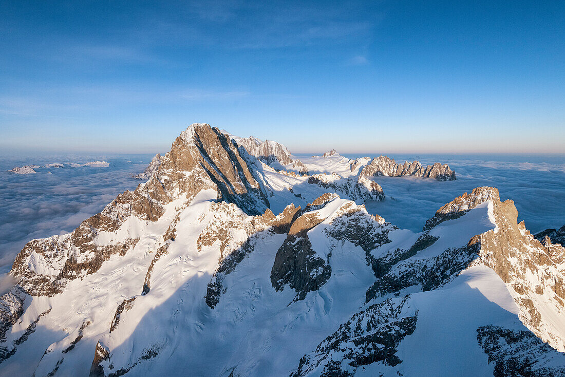 Aerial view of Grandes Jorasses and Mont Blanc in background during sunrise, Courmayeur, Aosta Valley, Italy, Europe