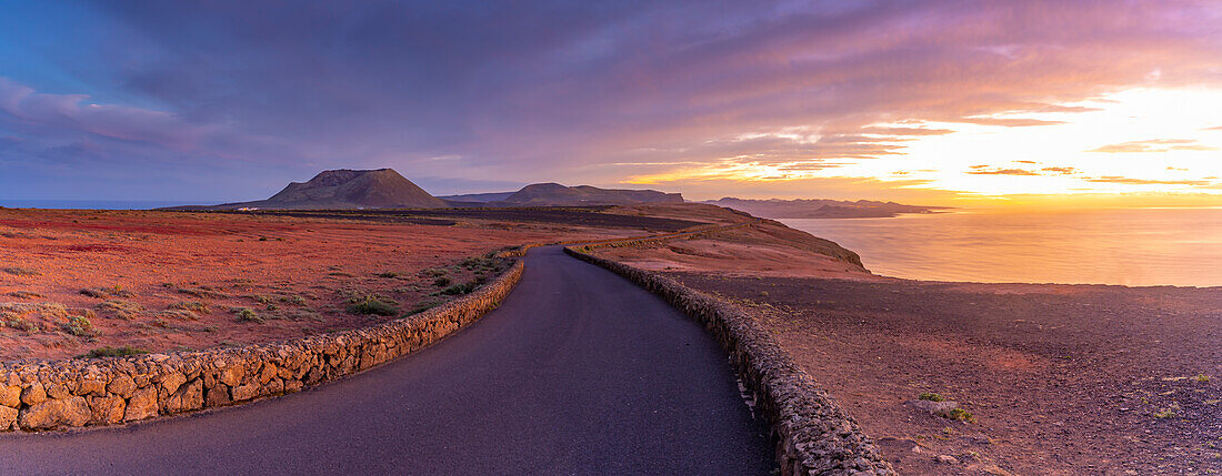 View of road and volcanic coastline from Mirador del Rio at sunset, Lanzarote, Las Palmas, Canary Islands, Spain, Atlantic, Europe