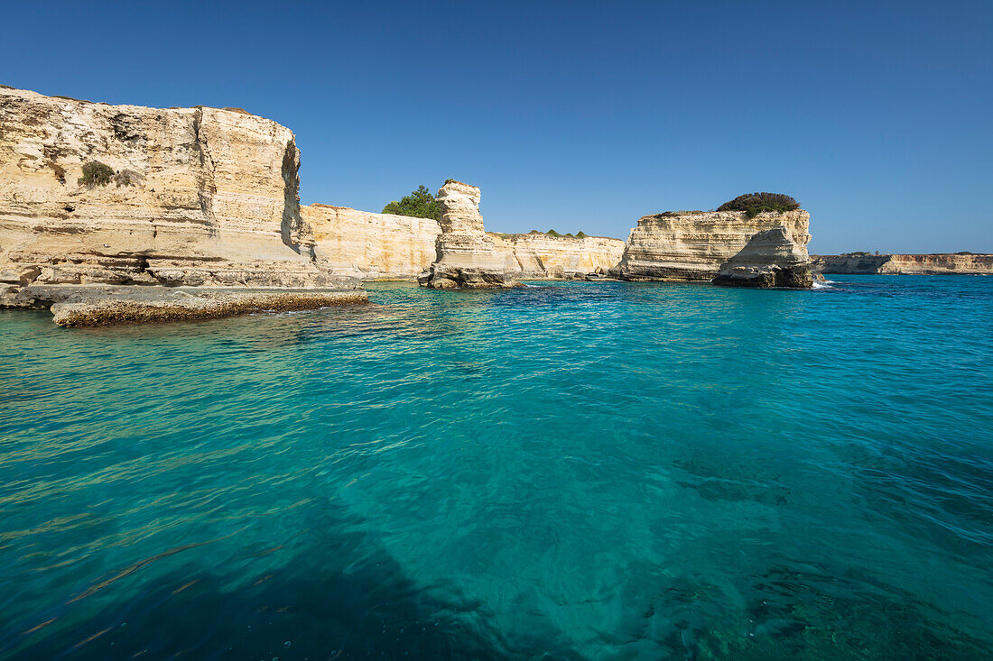 Rock stacks and crystal clear sea of the Faraglioni di Sant Andrea, Torre di Sant Andrea, Melendugno, Lecce Province, Puglia, Italy, Europe