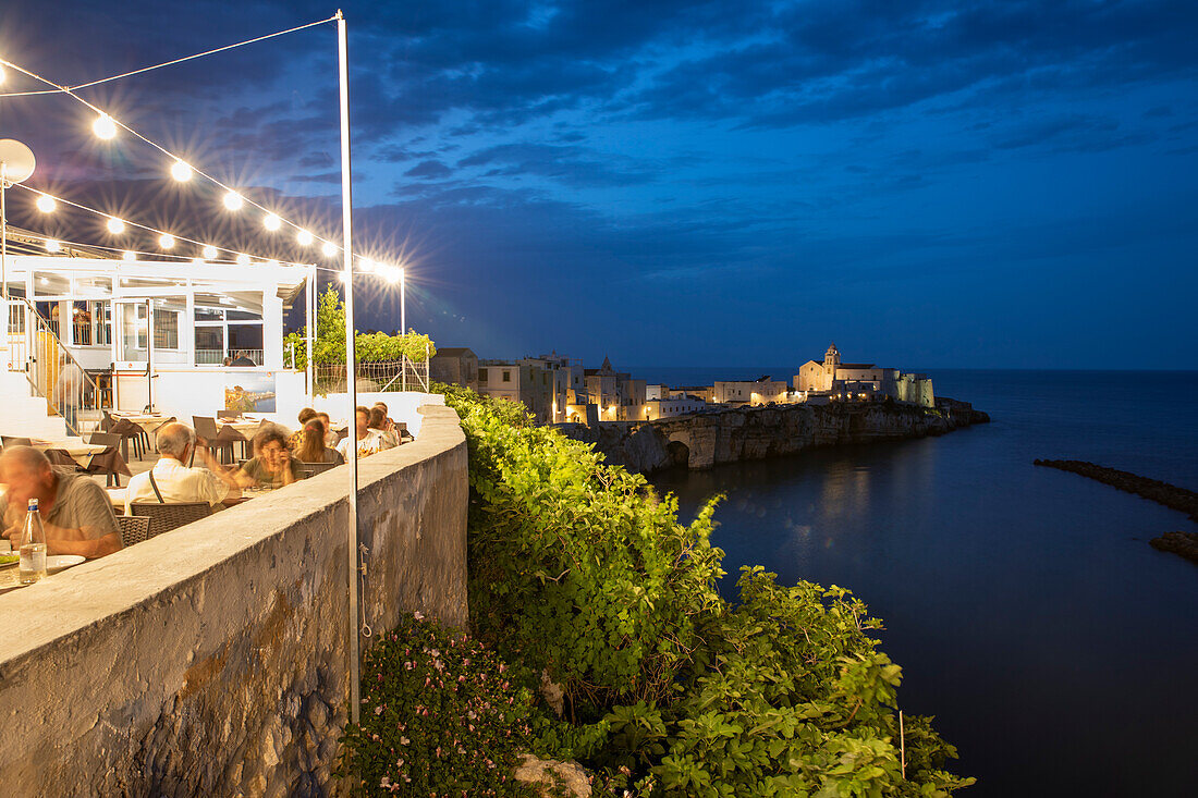 Restaurant in the old town on the promontory in the evening, Vieste, Gargano peninsula, Foggia province, Puglia, Italy, Europe