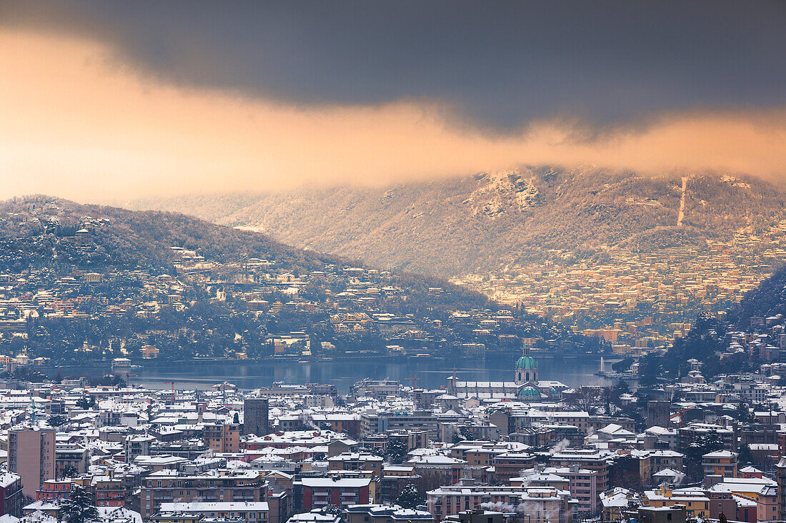 Sunset on Como city after the snowfall, lake Como, Lombardy, Italy, Europe