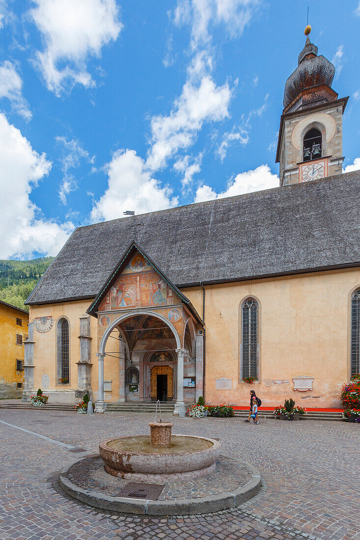 Mom and daughter walk in San Maria square, Pellizzano, Sole valley (val di Sole), Trento province, Trentino-Alto Adige, Italy, Europe (MR)