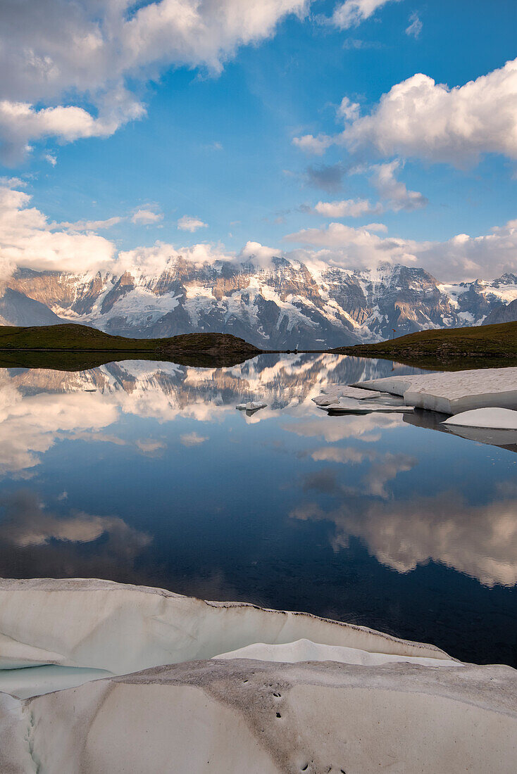 Jungfrau Group is mirrored at Grauseeli lake, Murren, Lauterbrunnen, Switzerland, Europe