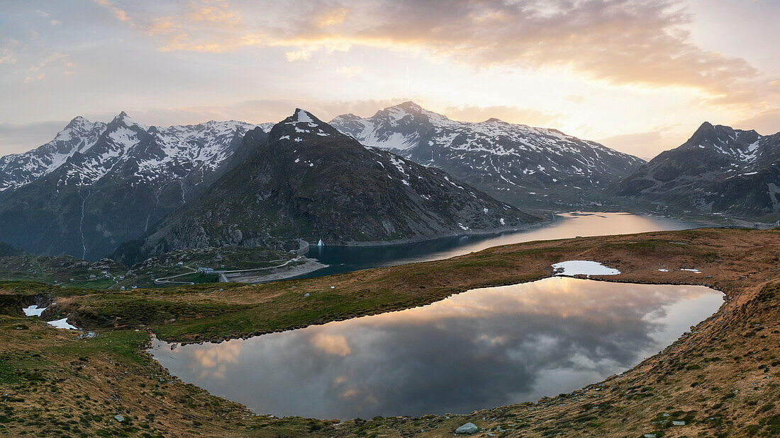 aerial view taken by drone of Andossi Lake, during a warm summer sunset, Spluga pass, Orobie mountain, Sondrio province, Lombardy district, Italy, Europe