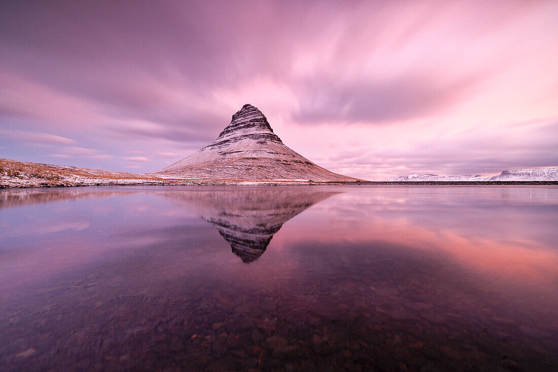a long exposure to capture the Kirkjufell mount reflected in a little lagoon during a winter sunrise, Snaefells Peninsula, Vesturland, Iceland, Europe
