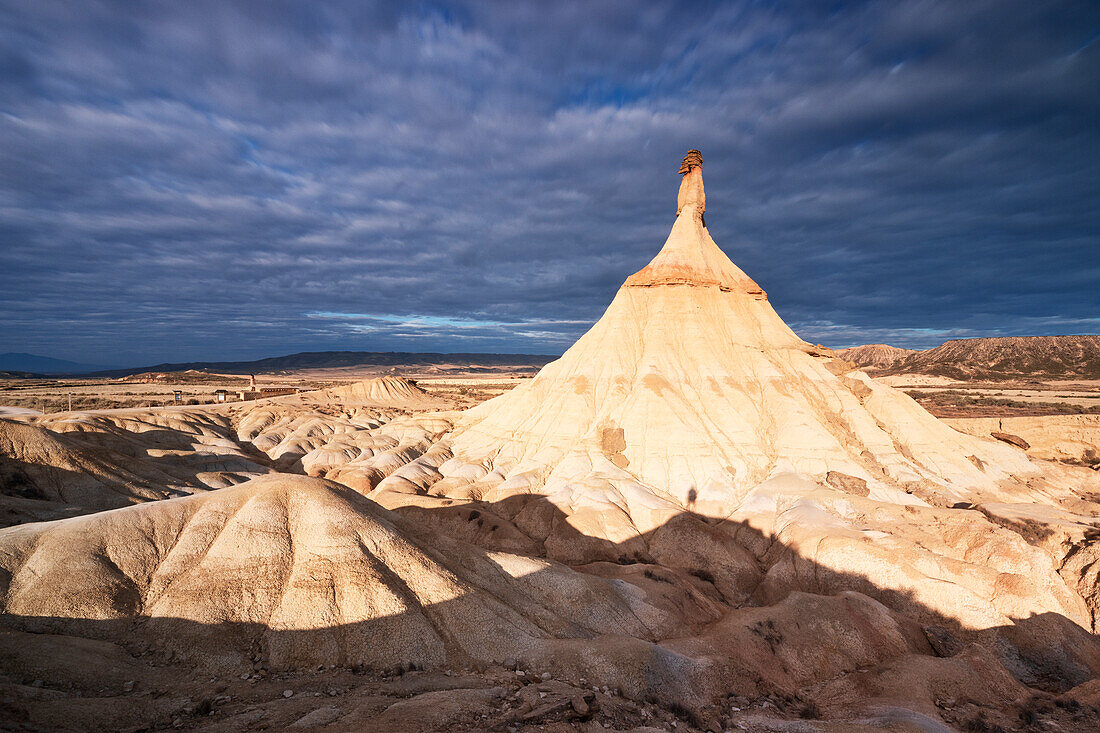 the iconic rock formation called Castel de Tierra during a warm summer sunrise, Bardenas Reales Natural Park, Navarra, Spain, Europe