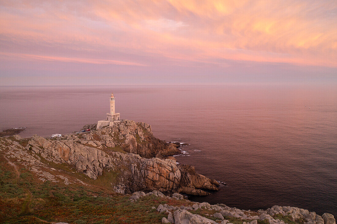 the lighthouse of Punta Nariga during a summer warm sunrise, municipality of Malpica de Bergantinos, Galixia, Spain, Europe