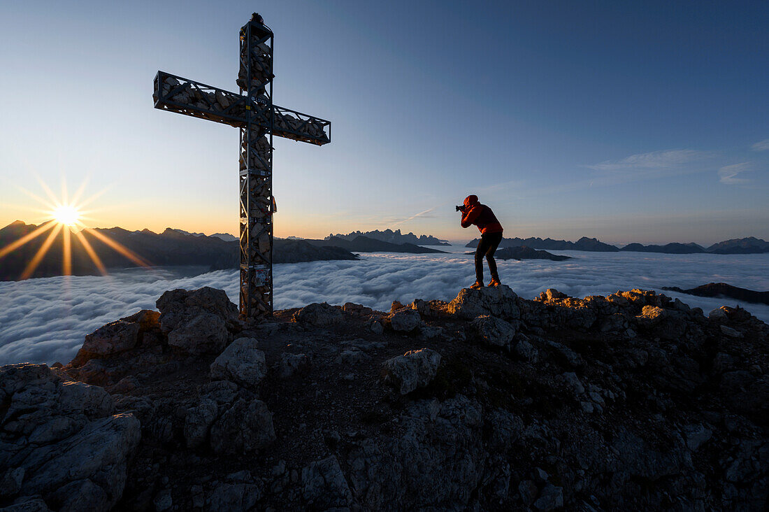 Europe, Italy, Trentino-AltoAdige, Carezza, Dolomites, South Tirol, Bolzano province. Sunrise on the cross of Roda di Vael