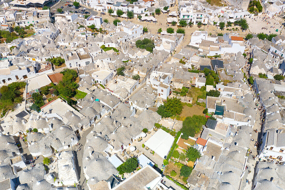 aerial view taken by drone of the typical village of Alberobello (Unesco World Heritage Site)(Unesco World Heritage Site) and its unique Trulli, during a splendid summer day, municipality of Alberobello, Bari province, Apulia district, Italy, Europe