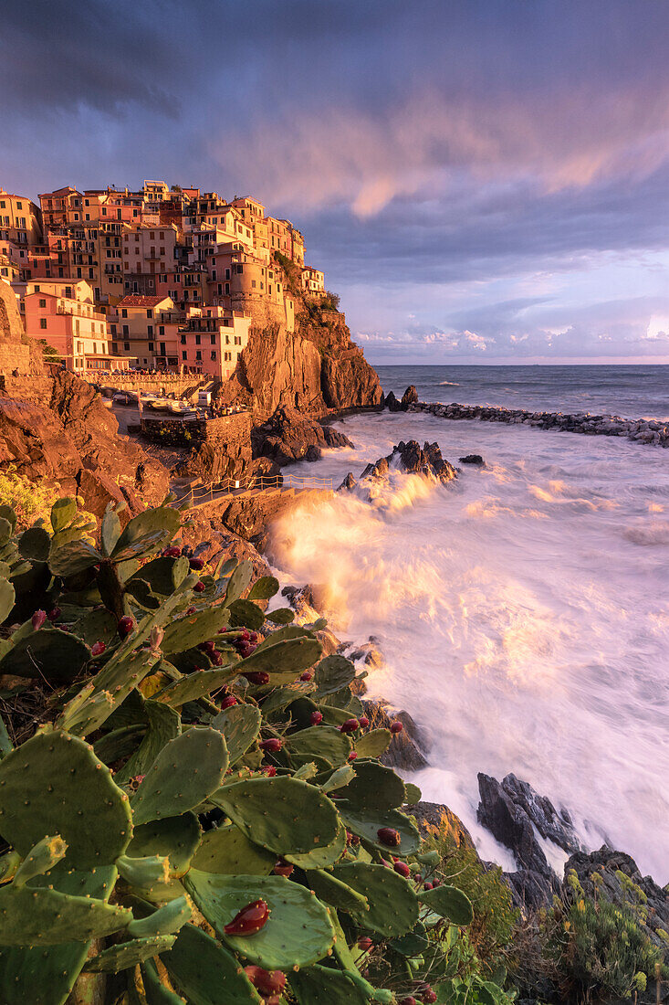 a long exposure to capture the autumn sunset in Manarola during a strong storm, National Park of Cinque Terre, municipality of Riomaggiore, UNESCO WORLD HERITAGE SITE, La Spezia province, Liguria district, Italy, Europe