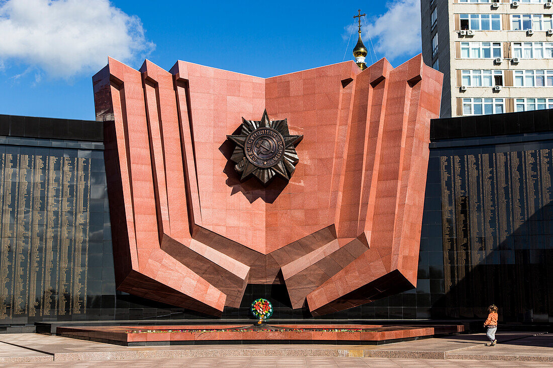 Boy in front of World War II monument in Khabarovsk