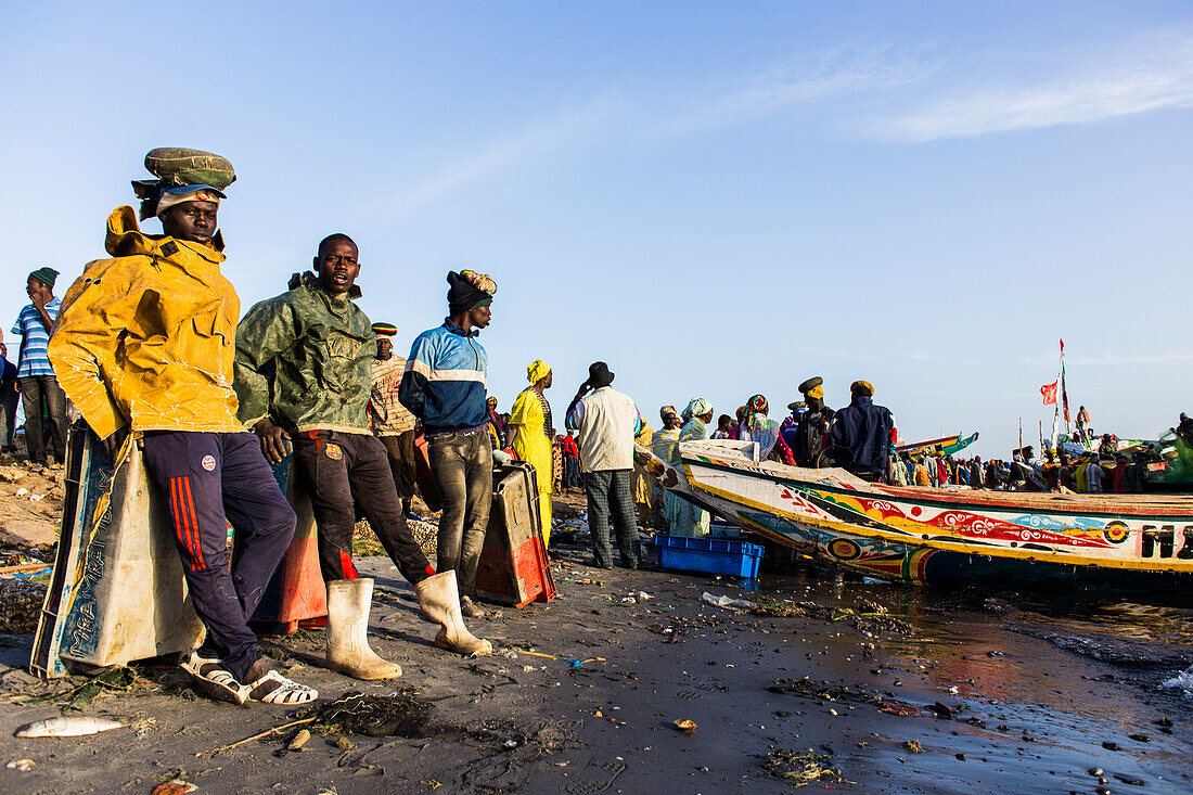 Fish market morning in Saint_Louis when the canoes arrive loaded with fish from the Atlantic ocean to sell it