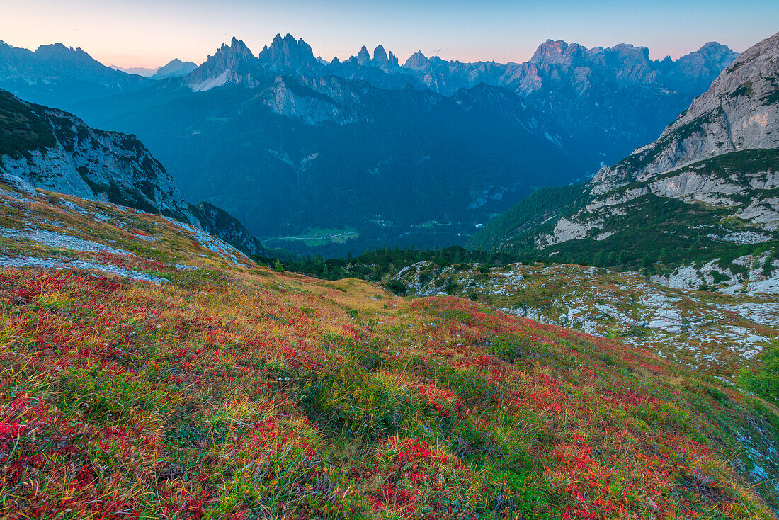 Marmarole mountain range at sunset, with a view of Cadini di Misurina and Tre Cime di Lavaredo. Belluno, Veneto, Italy.